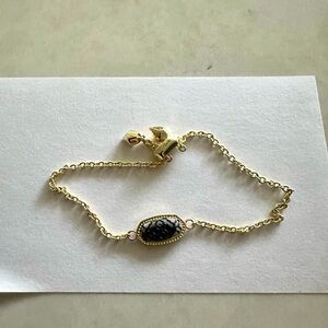 Kendra Scott gold and gunmetal bracelet.